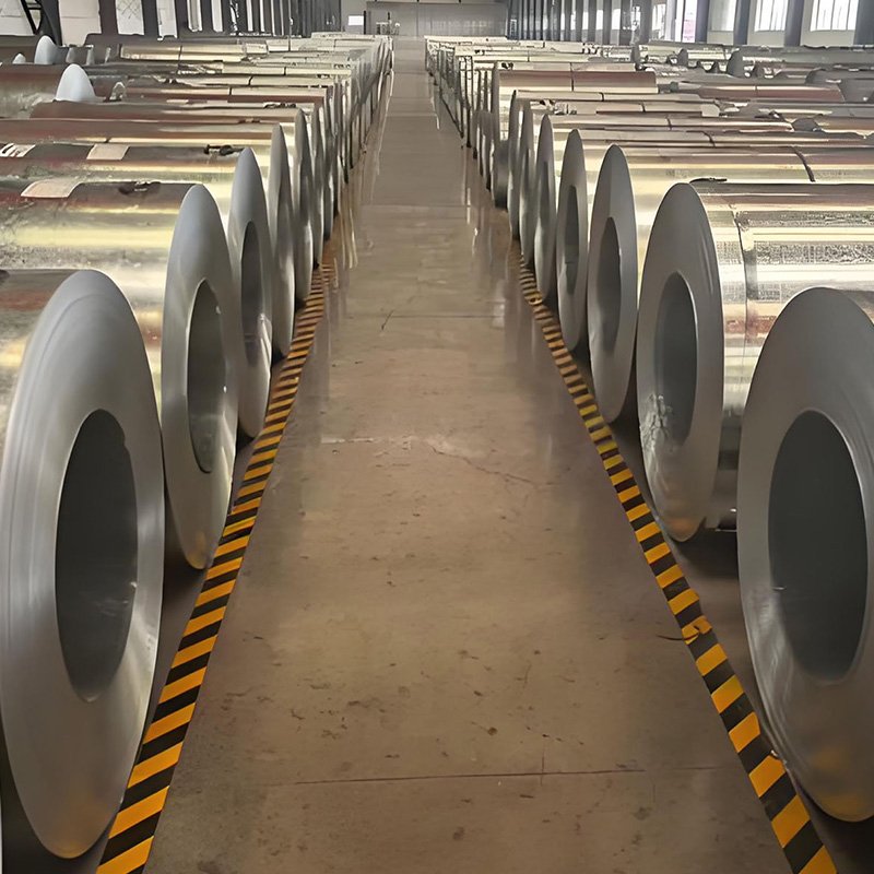 Large stock of big spangle hot dipped galvanized steel coils arranged in warehouse aisle