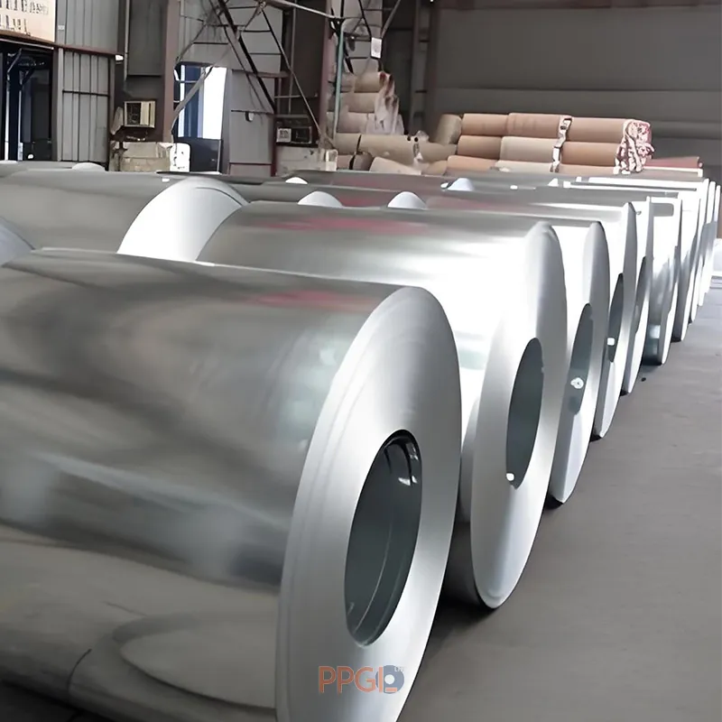 Array of prime full hard galvanized iron steel coils stored in factory warehouse