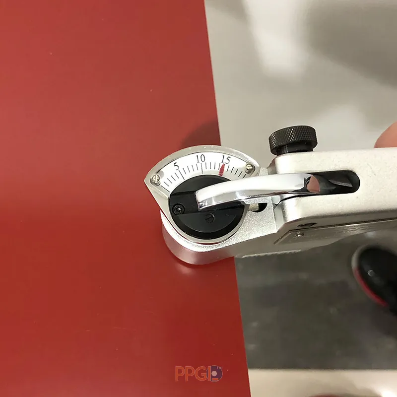 Precision gauge measuring paint film thickness on PPGI steel sheet surface