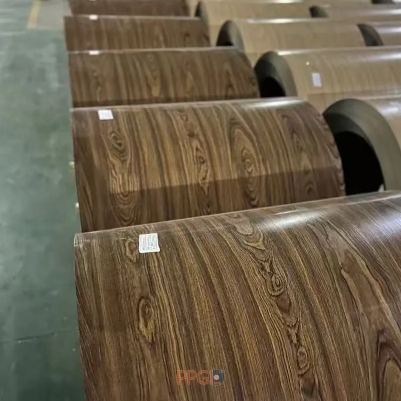 Multiple wood grain printed ppgi steel coils arranged in factory warehouse