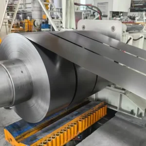 Precision steel coil slitting machine cutting wide steel sheet into custom width strips.
