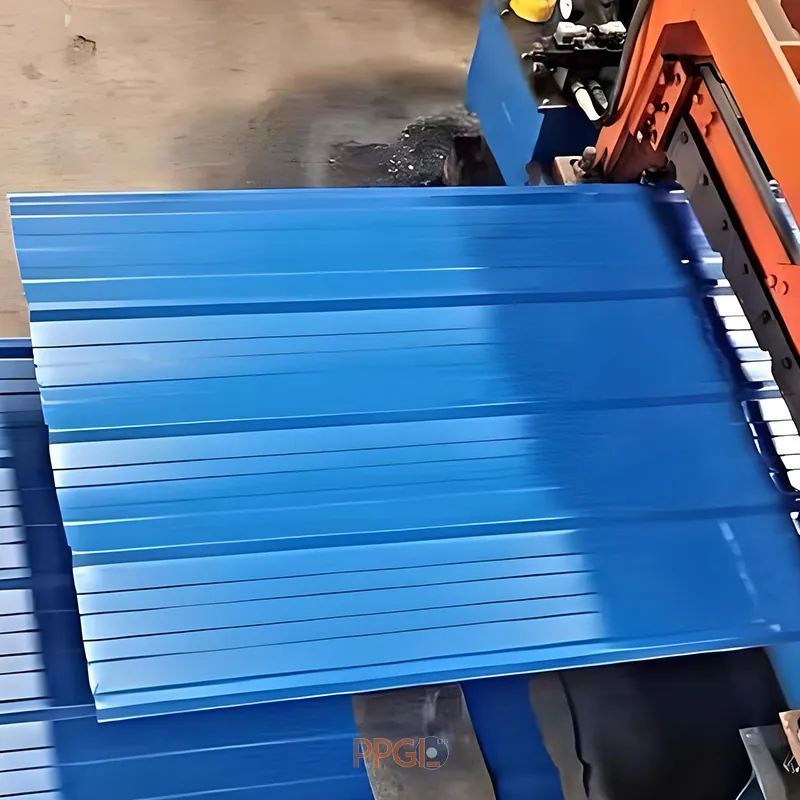 Blue PPGL trapezoidal roofing sheet coming off the roll forming machine