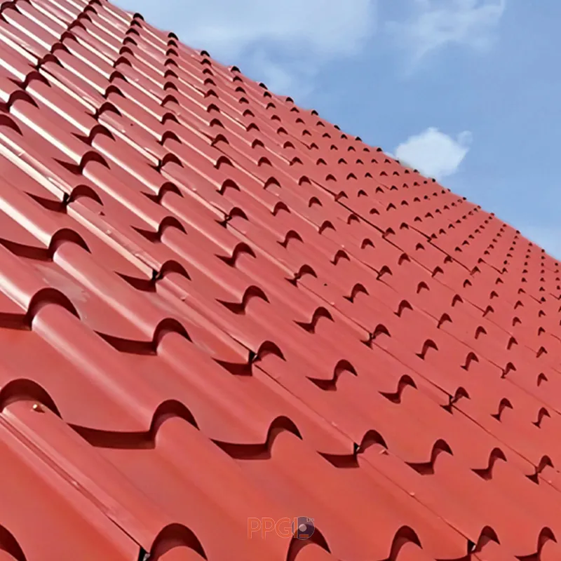 Red color coated step tile metal roofing sheet panel installed on residential roof